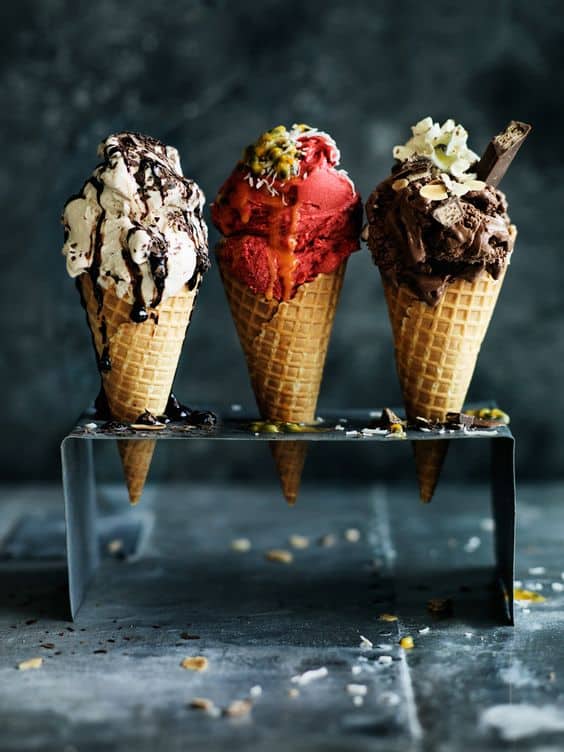 Ice cream cones standing on a surface